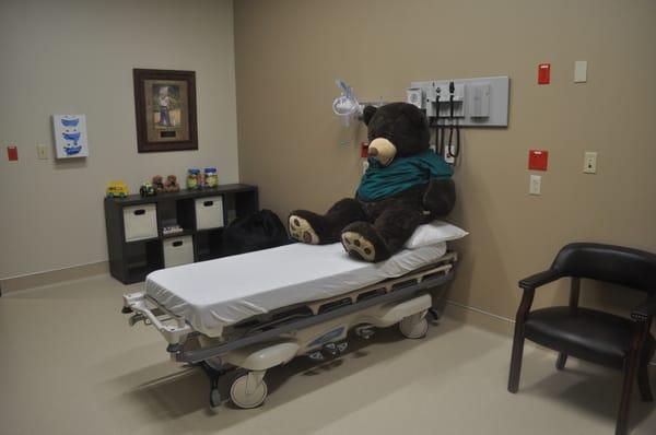 Our pediatric room is equipped with a huge bear, toys, games and a large TV so it feels like home!