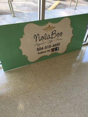 Metal sign for local retailer Nola Boo