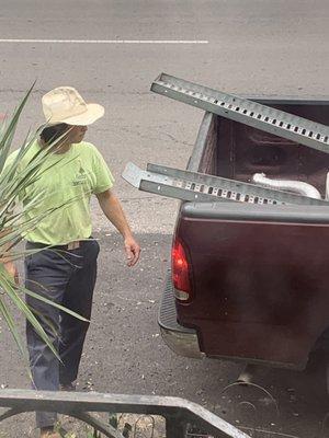 Worker walking around truck