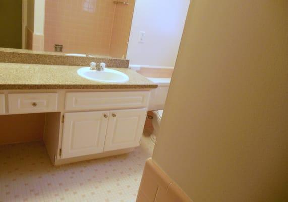 Large Bathroom with wood vanity cabinet and ceramic tile