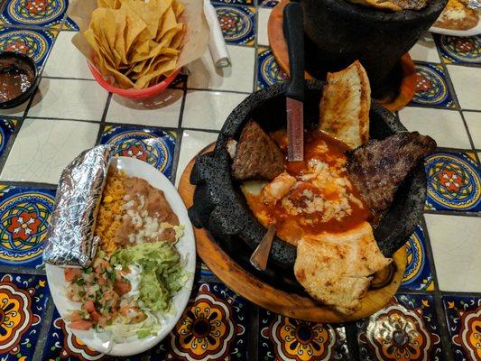 Molcajete ponchovilla (steak,chicken, and shrimp cooked inside dish in pic)