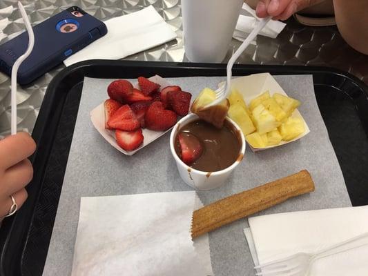 Milk chocolate with strawberries, pineapple and churro. It was so good, we couldn't stop eating to take a picture.