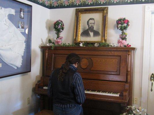 We have two antique pianos in the parlor for our guests to enjoy