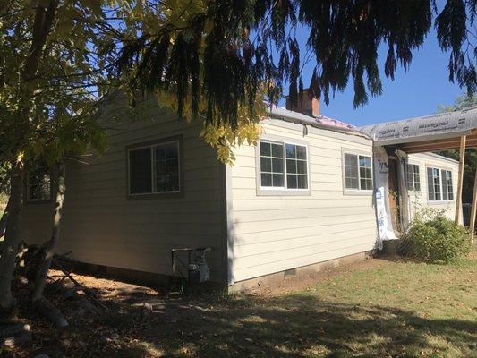 Demolition of old siding and installation of Hardie plank 6 inch exposure.