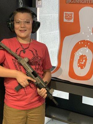 My sons first time, great grouping with the fully automatic Uzi 9mm.