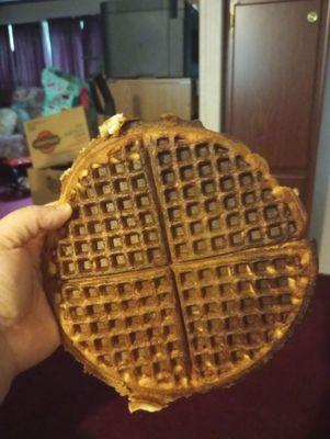 Holding up the burnt waffle