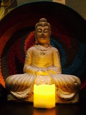 Buddha statue on the mantel of a yoga studio that felt incredibly cozy and serene.