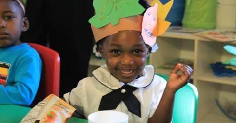 A happy student at the Inspiration Station Academy where children develop a lifelong love of learning