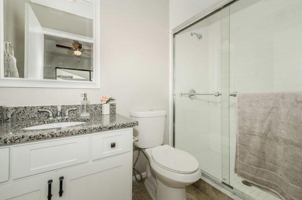 New master bathroom added to the home with a new stand up shower, vanity and paint.