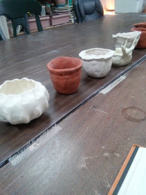 Examples of bowls and pinching pots.