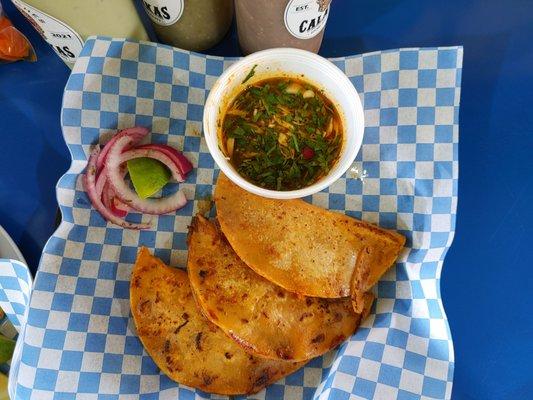 Quesatacos with Consumme and pickled onions.