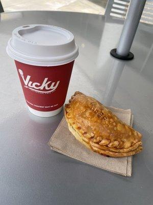 baked empanada and cafe con leche