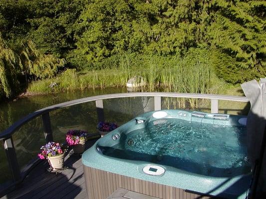 Jacuzzi dual waterfall hydrotherapy spa on private deck overlooking the pond