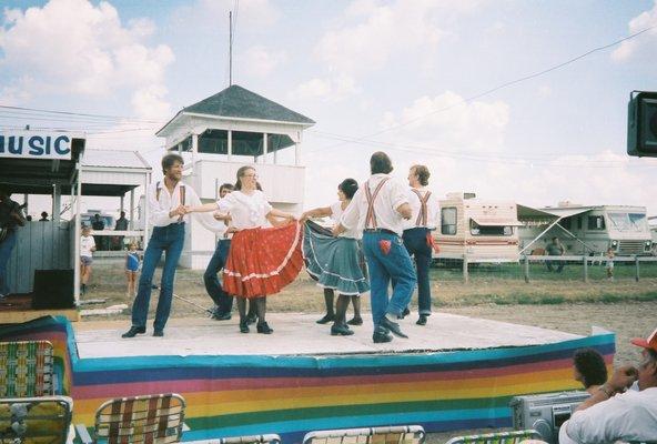 The Kickapoo Cloggers on stage at Clark County Fairgrounds. The women are doing something called "skirt work."