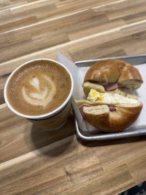 Latte and egg, ham & cheese bagel