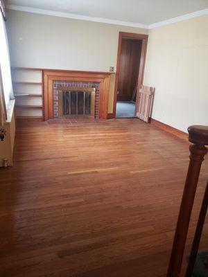 Old couch, love seat, chairs and table were cleaned out of the living room, as were the items stored in the room in the rear.