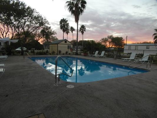 In ground pool with Fire pit area and seating