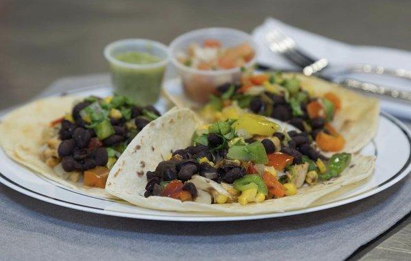 Veggie tacos on flour tortillas.