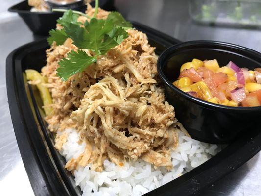 Chicken Ropa Vieja with house salsa, white rice and bell pepper medley.