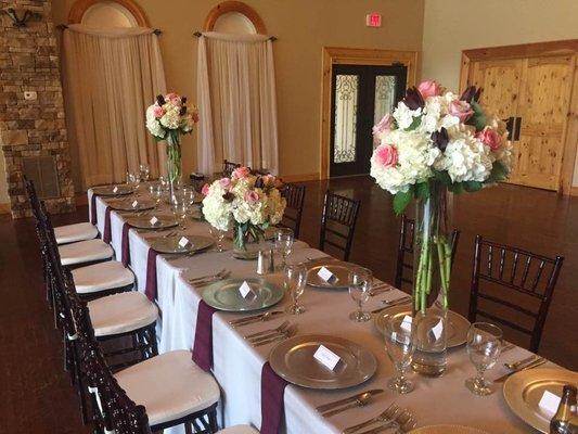 The setup decided for the head table complete with beautiful flowers by Elegant Blooms!