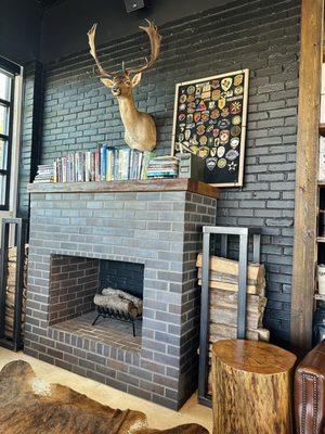 Cute seating area by the fireplace.