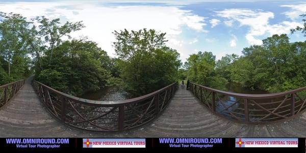 County park bridge spanning a creek panorama converted from a 360 virtual tour.