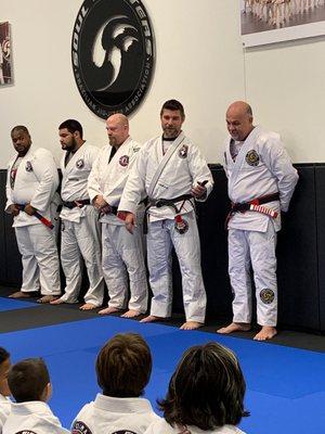 Black Belts on the mat.