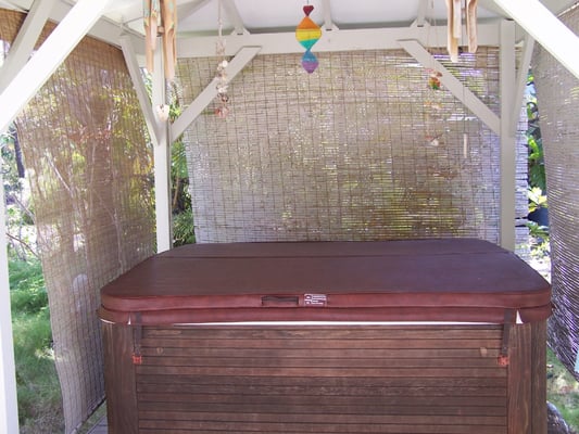 Private hot tub in gazebo in yard