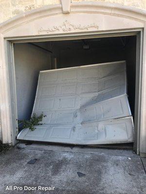 Garage door blown in by a tornado about to be replaced.