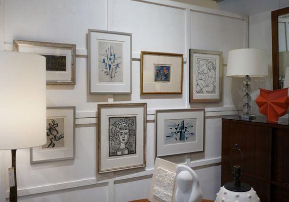 We typically have 50-100 pieces of original artwork in interesting frames.