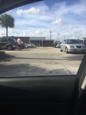 Full parking lot in addition to full on-street parking and lots of cars in overflow.