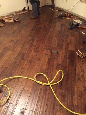 Hard wood flooring being installed diagonally