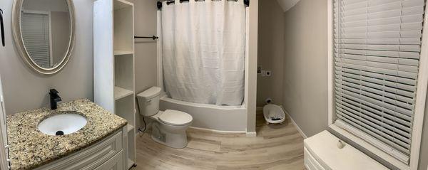 Installed plumbing, vanity, toilet, bathtub and connection for washer/dryer.