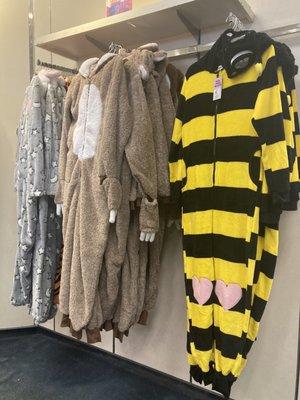 Halloween onesies, including a starry sky, a sloth and a bee