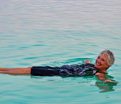 The Dead Sea's unusually high salt concentration means that people can easily float!