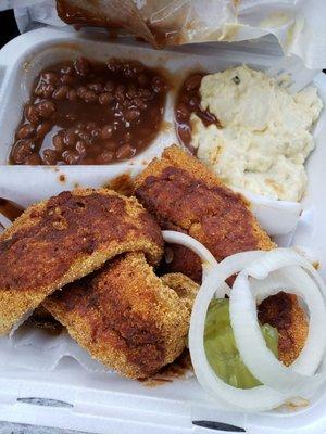 Hot fish plate with potatoe salad and baked beans.