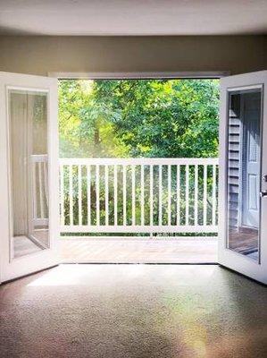 French doors open onto a private balcony!