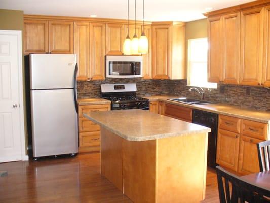 After. Glazed Maple cabinets with new island layout.