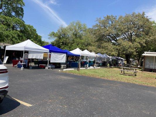 A section of this church parking lot is being used for farmers market.