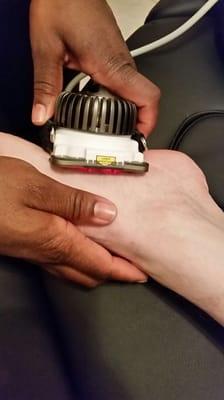 Deep heat laser treatments help heal damaged tissue. Here it's being used for plantar fasciitis. He was able to win a burpee contest!