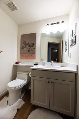 Fully remodeled bathroom with custom cabinets, vanity installation and counter top by North Seattle Handyman