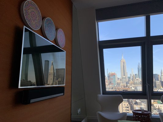 Somy 55" with Sonos sound-bar at bedroom of midtown apartment