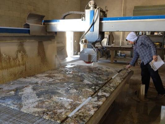 Cutting out counter tops with the big saw.