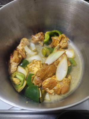 Curry chicken seasoned with bell peppers, celery.