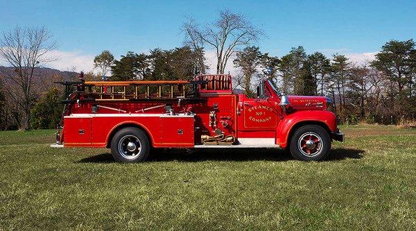 Engine 59. Mack B-85 Thermodyne fire engine with open cab.