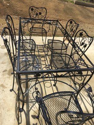 50 year old wrought iron table and chairs. Picture taken after powder coated black and before glass top was placed back on.