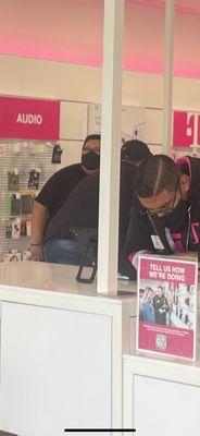 Boy with an attitude on his phone ignoring customers