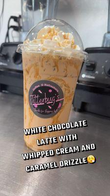 White chocolate, iced latte, whipped cream, and caramel drizzle