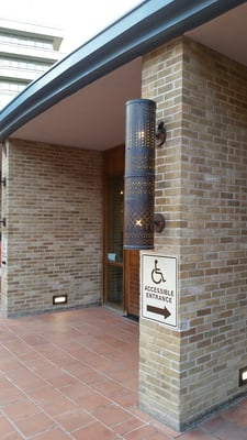 Wheelchair accessible to the right side of building