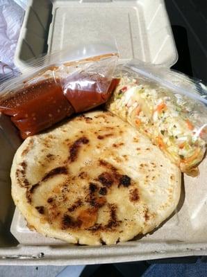 Nice amount of salsa and pickled cabbage in those bags. Pretty big pupusa too.